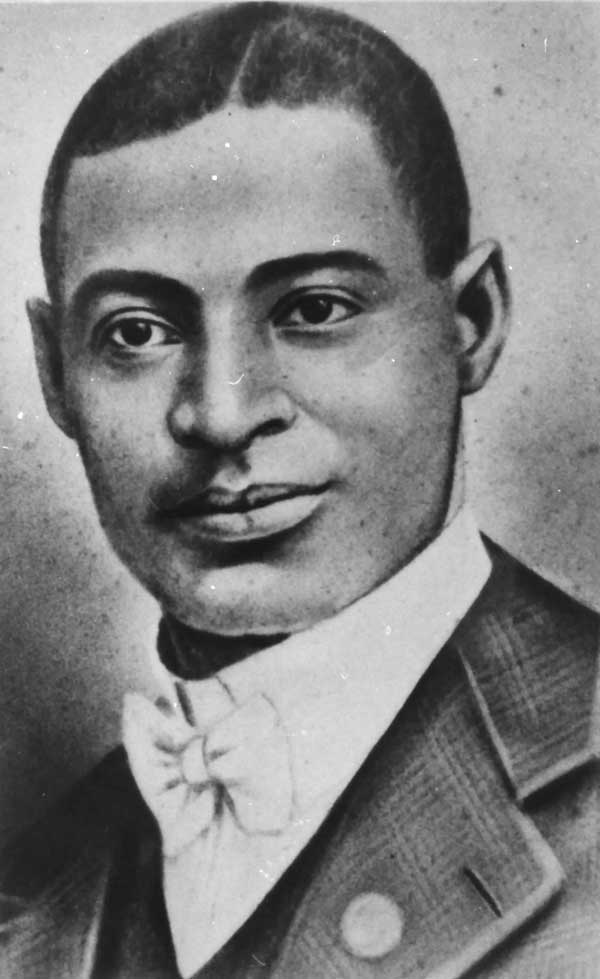 A portrait Buddy Bolden in white tie, gazing to the photographer's right