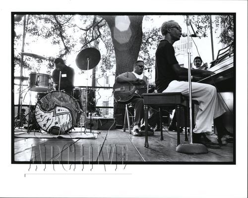 Professor Longhair plays the piano in this black-and-white film photo, circa 1970s.