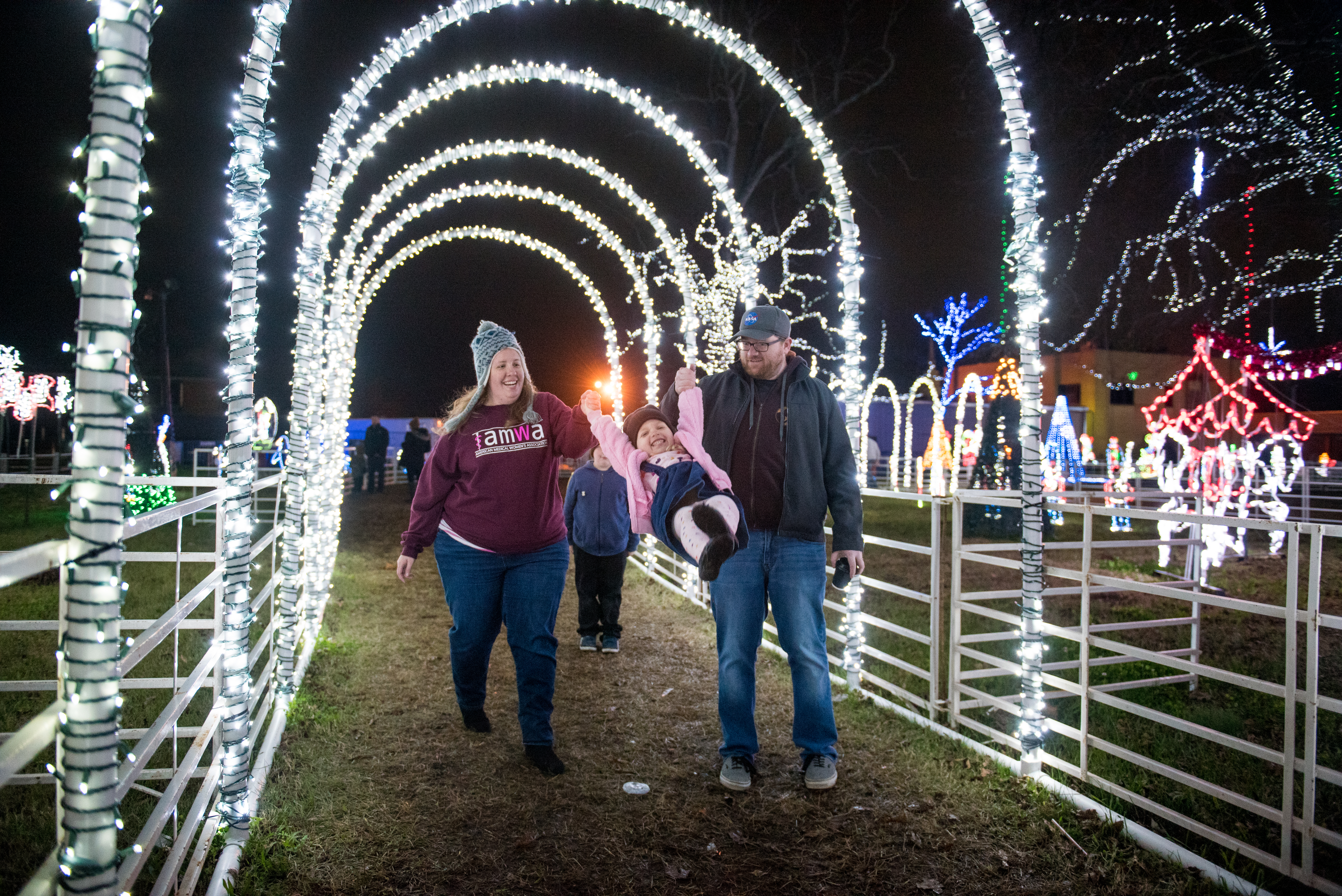 Family enjoying the winter season during Holiday Trail of Lights.