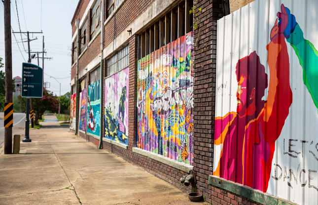 monroe local artists paint the streets of downtown on monroe main street