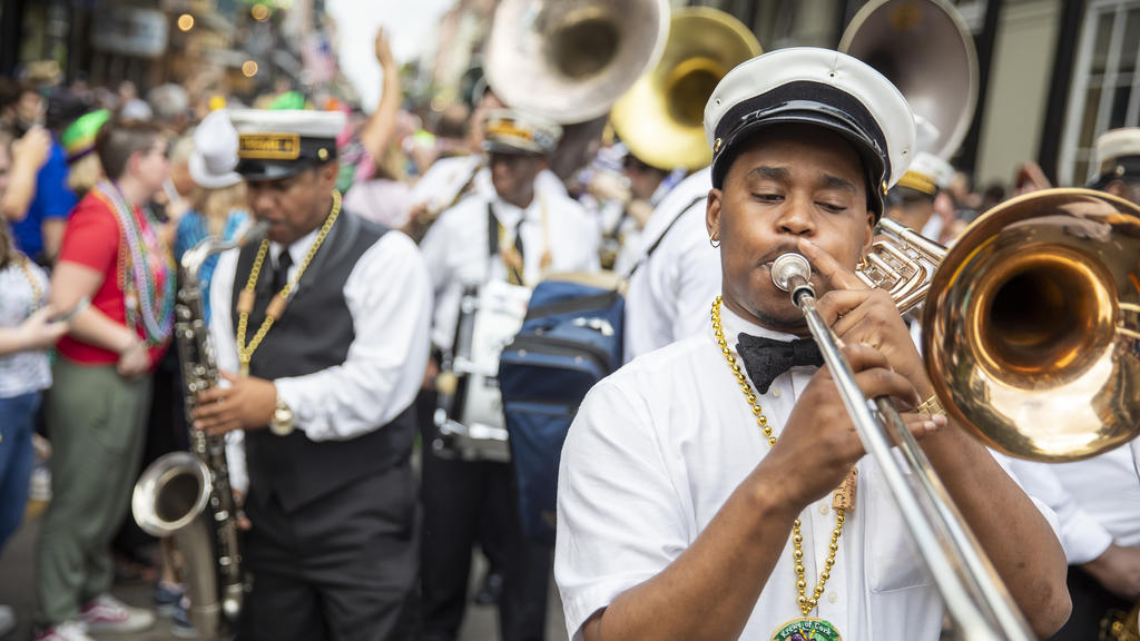 Enjoy second lines and jazz music during Mardi Gras parades.