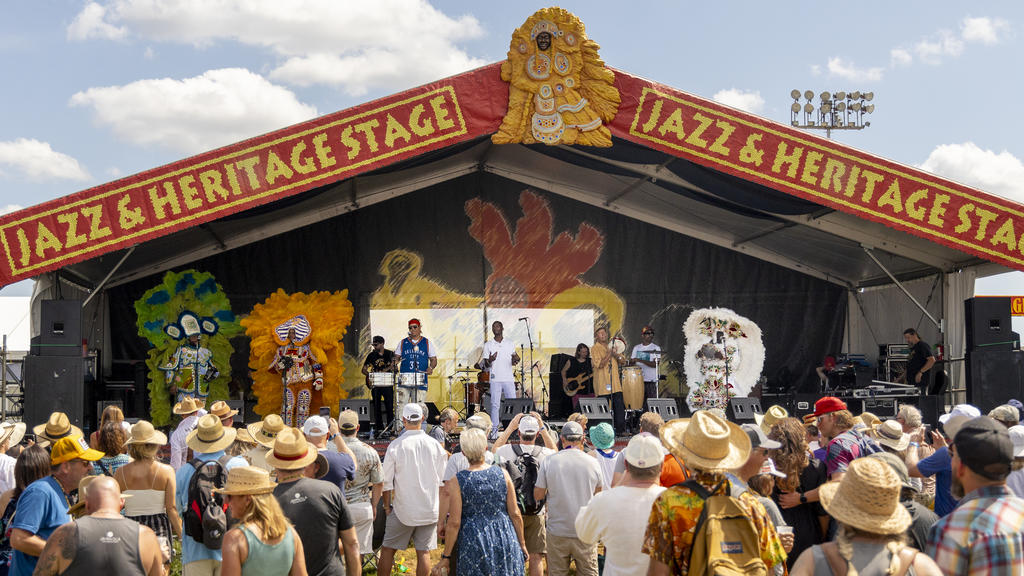 A hip hop ensemble takes the JazzFest main stage.