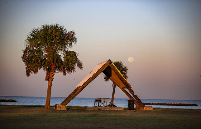 A picnic pavilion during sunset at Cypremort Point State Park.