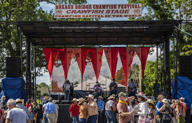 People dance to live music at the Breaux Bridge Crawfish Festival.