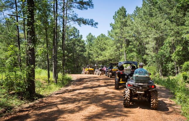 ATVs off-road along dirt trails