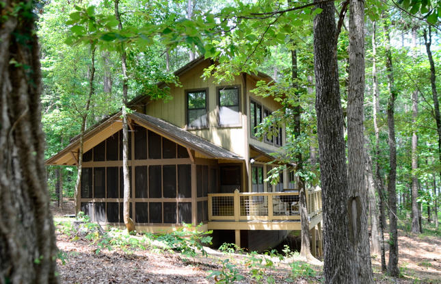 A wooden cabin in the woods of Lake Claiborne State Park.