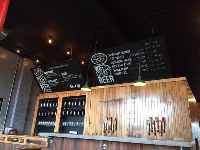 Tasting room bar featuring a circa 1930 antique wooden cooler.