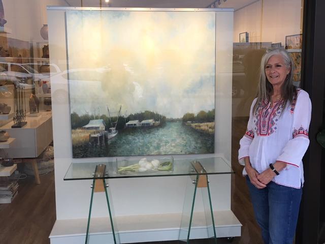 Kathy Biedenharn, Owner I Levee Gallery with Dr. Charles Guess Painting Photo