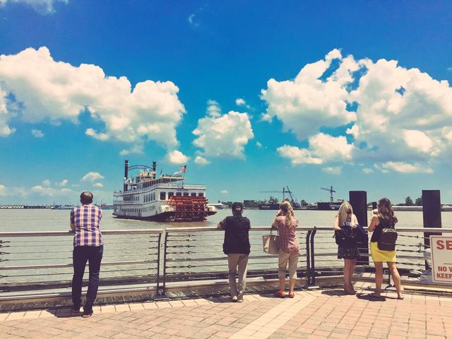 Watching the Paddlewheeler Creole Queen sail away from the dock Photo 2