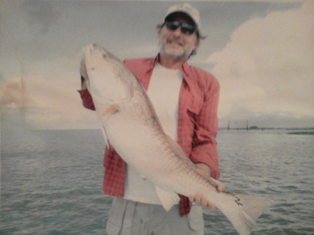 Captain Dave with a large Bull Redfish