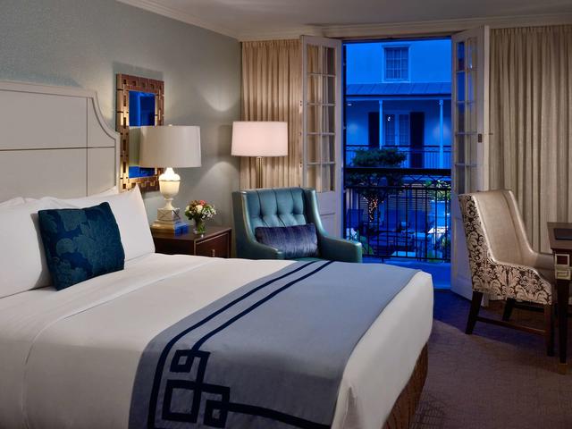 Elegant room with balcony overlooking Bourbon Street