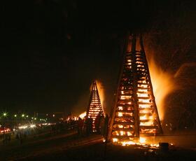 A large wooden structure set on fire during the Louisiana tradition Bonfires on the Levee.