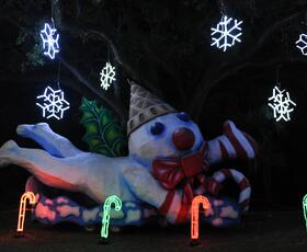 A playful snowman figurine welcomes guests to Celebration in the Oaks.