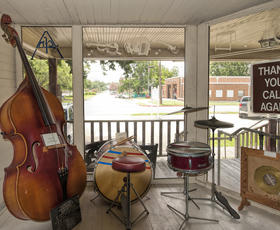 An interior image of Cajun music hall of fame showing musical instruments