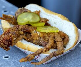 Seafood sandwich with pickles at New Orleans Jazz Fest.