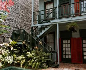 The pool, garden and exterior of The Frenchmen Hotel in New Orleans.