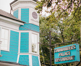 The iconic aqua blue and white exterior of Commander's Palace is a well-known sight in New Orleans.
