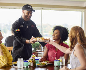 Guests enjoy a meal at Orlandeaux's Cafe.