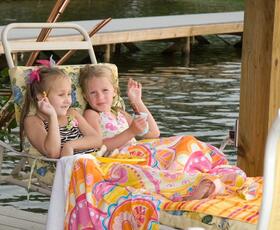 Two children relax on Toledo Bend lake.