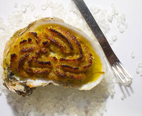 Oysters Bienville by Brigtsen's Restaurant in New Orleans, topped with a blond roux and baked to golden perfection.