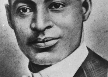 A portrait Buddy Bolden in white tie, gazing to the photographer's right