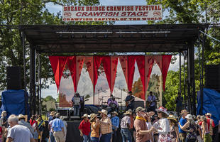 People dance to live music at the Breaux Bridge Crawfish Festival.