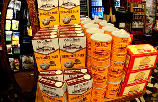 A colorful display of Cafe Du Monde beignet mix, coffee with chicory and creamy pralines.