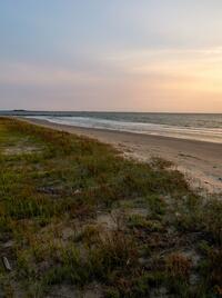 A stunning sunset view from the beach at Grand Isle State Park.